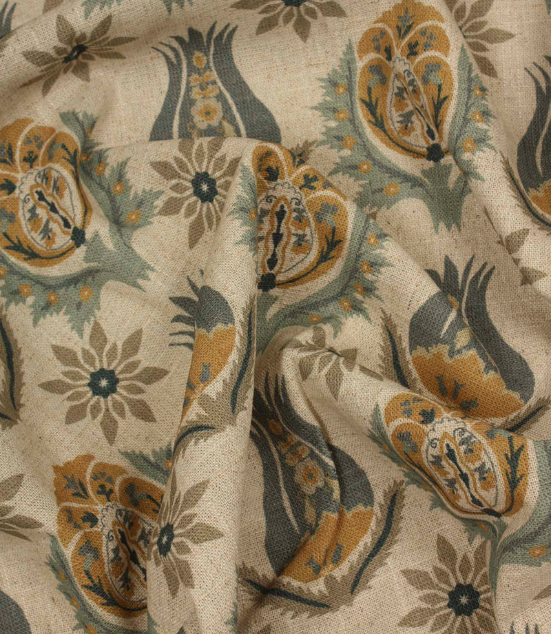 Draped botanical print fabric with stylised floral motifs in soft blue, mustard and natural linen shades.