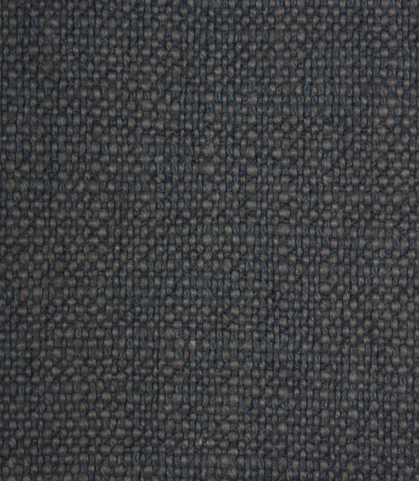 Close-up detail of Trento woven plain fabric in indigo, highlighting the rich texture and durable woven construction.