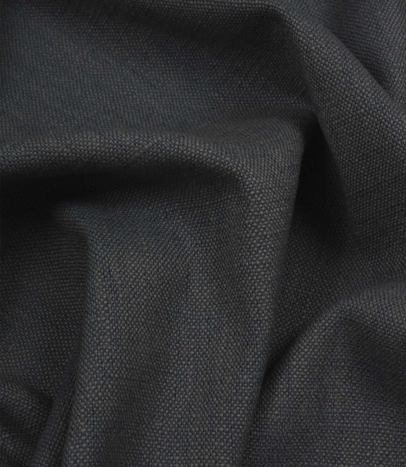 Trento woven fabric in indigo draped in soft folds, illustrating its natural texture and suitability for curtains, blinds and cushions.