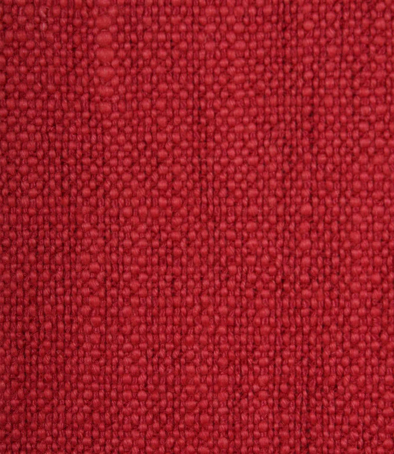 Close-up detail of Trento woven plain fabric in peony, highlighting the rich texture and durable woven construction.