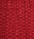 Close-up detail of Trento woven plain fabric in peony, highlighting the rich texture and durable woven construction.