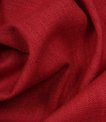 Trento woven fabric in peony draped in soft folds, illustrating its natural texture and suitability for curtains, blinds and cushions.