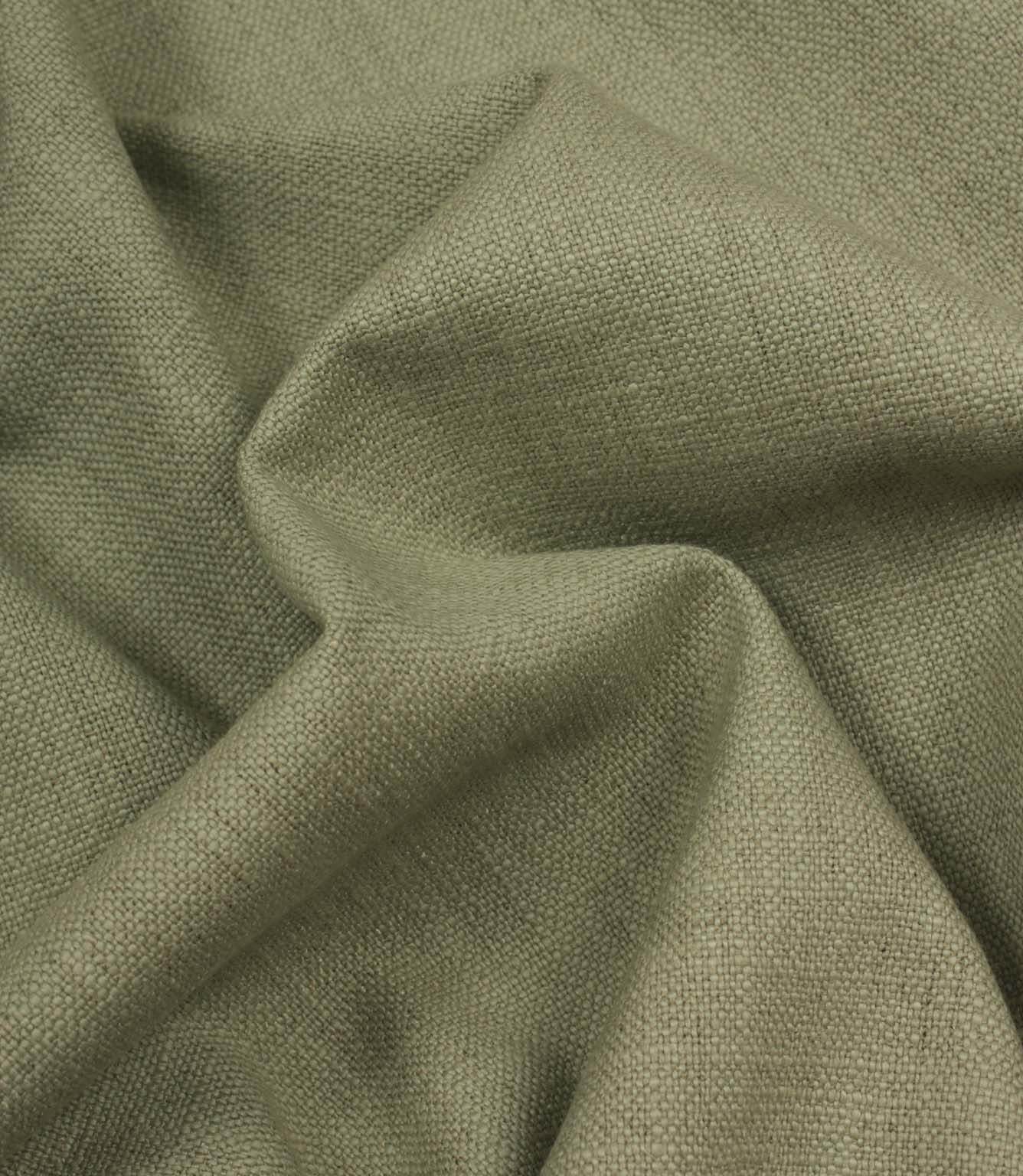 Trento woven fabric in sage draped in soft folds, illustrating its relaxed texture and suitability for curtains, blinds and cushions.