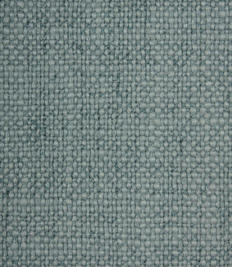 Close-up detail of Trento woven plain fabric in sky, highlighting the rich texture and characterful woven construction.