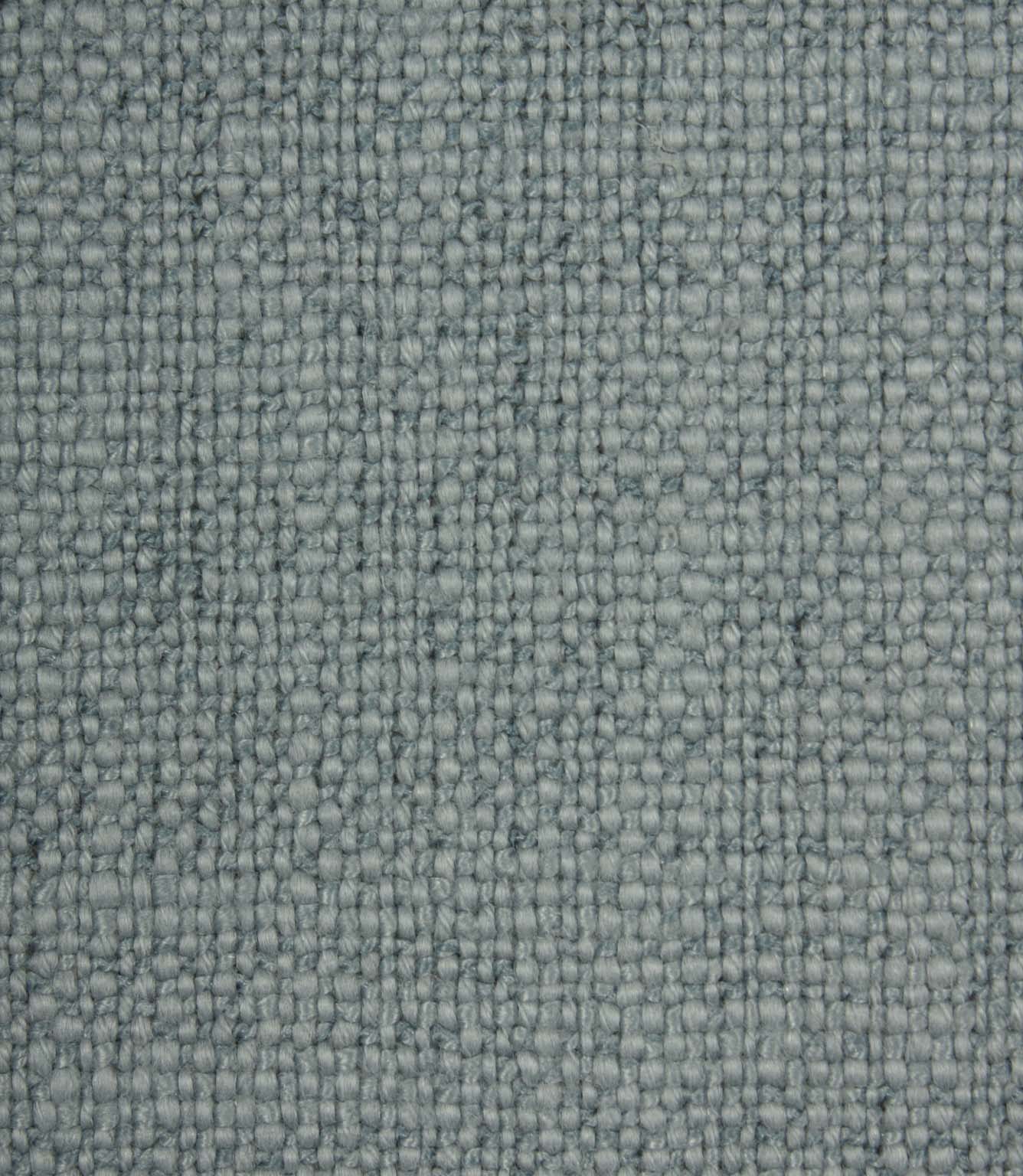 Close-up detail of Trento woven plain fabric in sky, highlighting the rich texture and characterful woven construction.