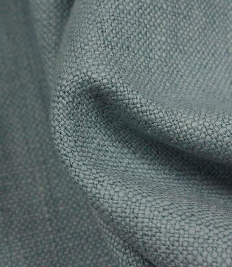 Detailed close-up of Trento plain woven fabric in sky, featuring the tactile weave and softly textured appearance.