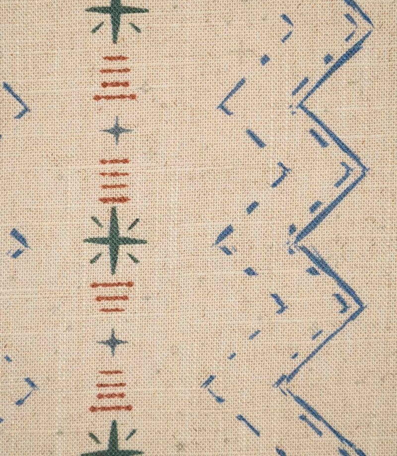 Close-up of Twilight Mill Blue Chestnut fabric showing the hand-drawn geometric motif with stitched zigzags and decorative star details.