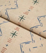 Folded Twilight Mill Blue Chestnut fabric showcasing the textured woven finish and small-scale geometric pattern.
