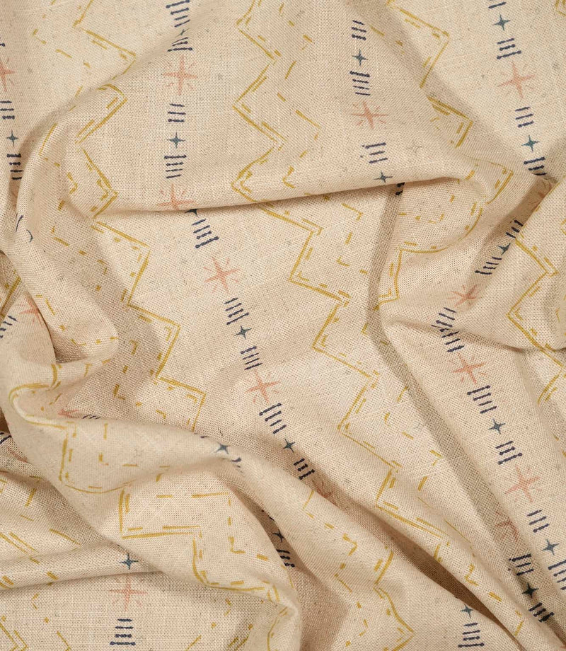 Twilight Mill Gold fabric draped to demonstrate its soft handle and decorative small-scale geometric print.