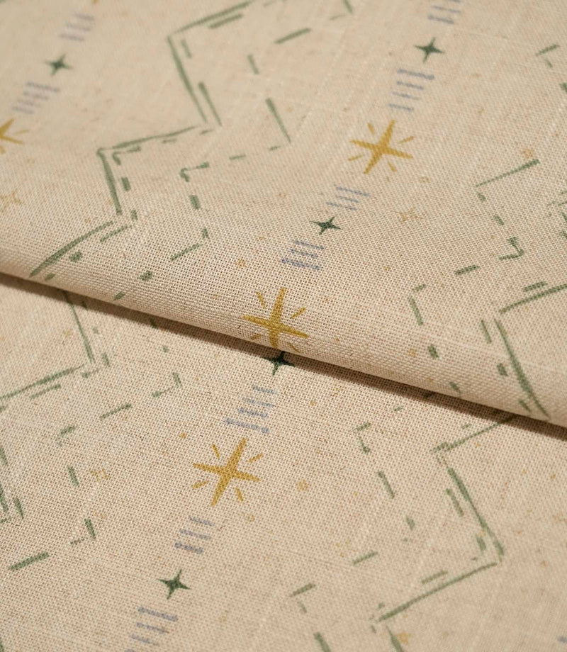 Folded Twilight Mill Green Apple Gold fabric showcasing the textured woven finish and small-scale geometric pattern.