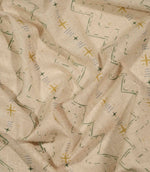 Twilight Mill Green Apple Gold fabric draped to demonstrate its soft handle and decorative small-scale geometric print.