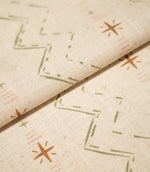 Folded Twilight Mill Olive Green Hazelnut fabric showcasing the textured woven finish and small-scale geometric pattern.