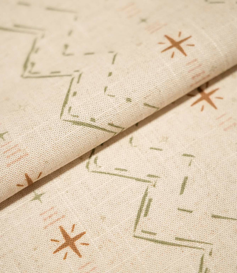 Folded Twilight Mill Olive Green Hazelnut fabric showcasing the textured woven finish and small-scale geometric pattern.