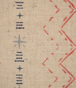 Close-up of Twilight Mill Red Steel Blue fabric showing the hand-drawn geometric motif with red zigzags, steel blue stars and linear accents.