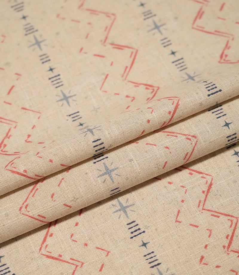 Layered Twilight Mill Red Steel Blue fabric displaying the small-scale geometric design and natural woven texture.
