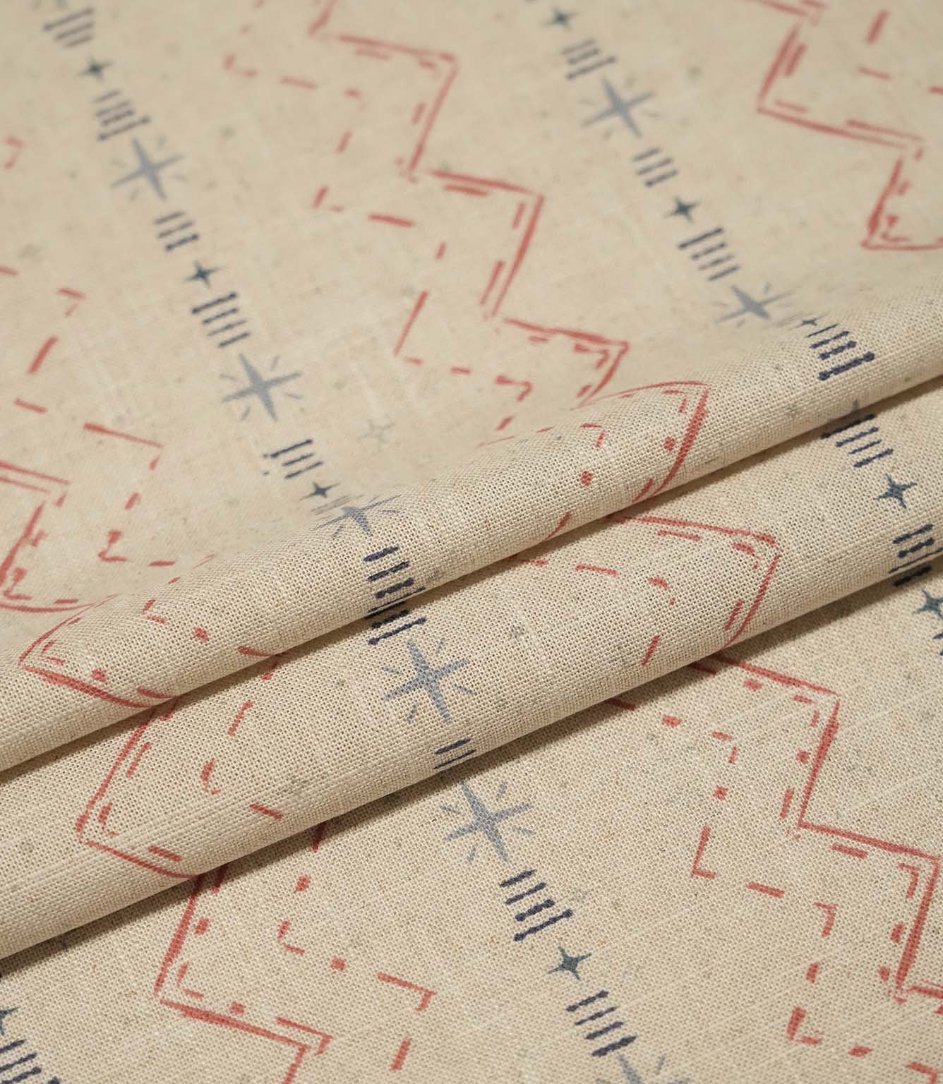 Layered Twilight Mill Red Steel Blue fabric displaying the small-scale geometric design and natural woven texture.