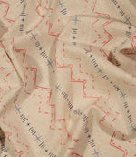 Twilight Mill Red Steel Blue fabric draped to demonstrate its soft handle and contemporary geometric print.