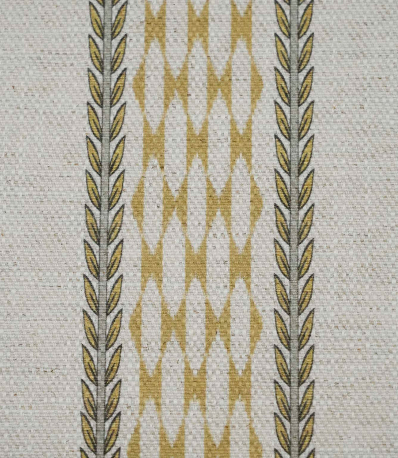 Close-up of Varese Gold extra wide contemporary foliage upholstery fabric showing the detailed woven texture and vertical pattern.