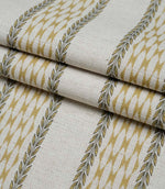Folded Varese Gold extra wide fabric showing its woven finish and contemporary foliage stripe design.