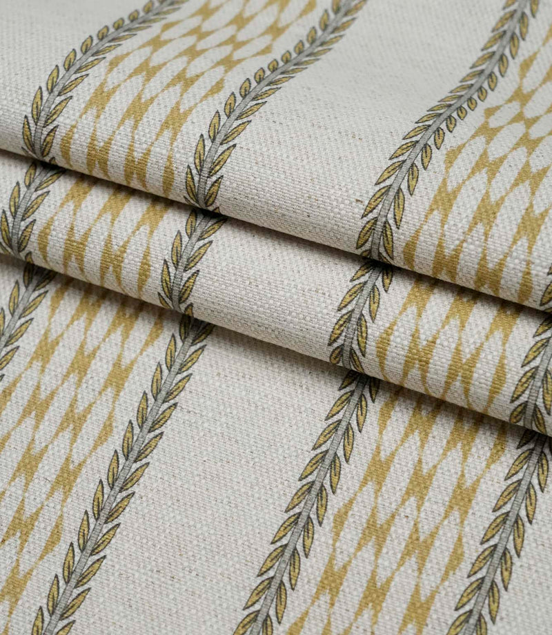 Folded Varese Gold extra wide fabric showing its woven finish and contemporary foliage stripe design.