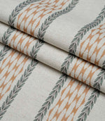 Folded Varese Rust extra wide fabric showing its woven finish and contemporary foliage stripe design.