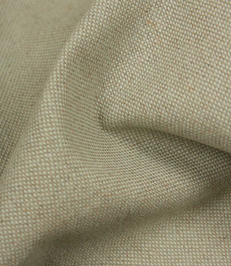 Close-up of textured beige fabric with a subtle pattern
