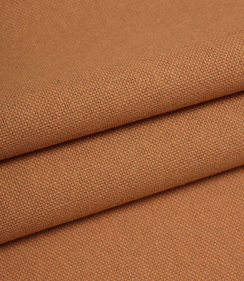 Close-up of orange woven fabric with a textured pattern