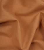 Close-up of orange fabric with visible texture