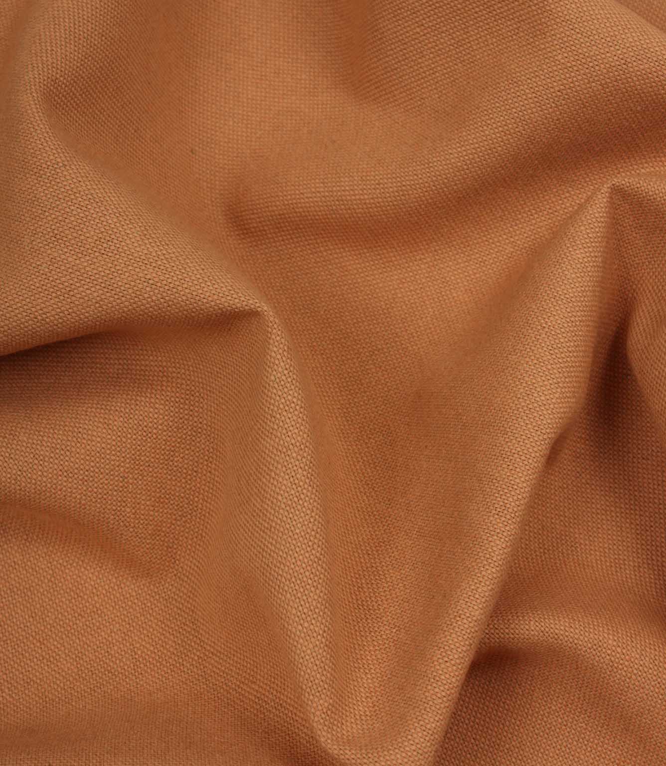 Close-up of orange fabric with visible texture