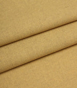 Close-up of yellow fabric with a textured pattern