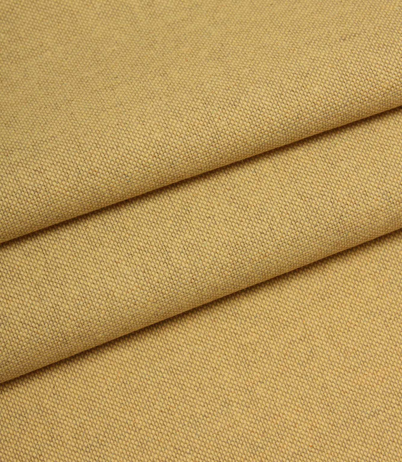 Close-up of yellow fabric with a textured pattern