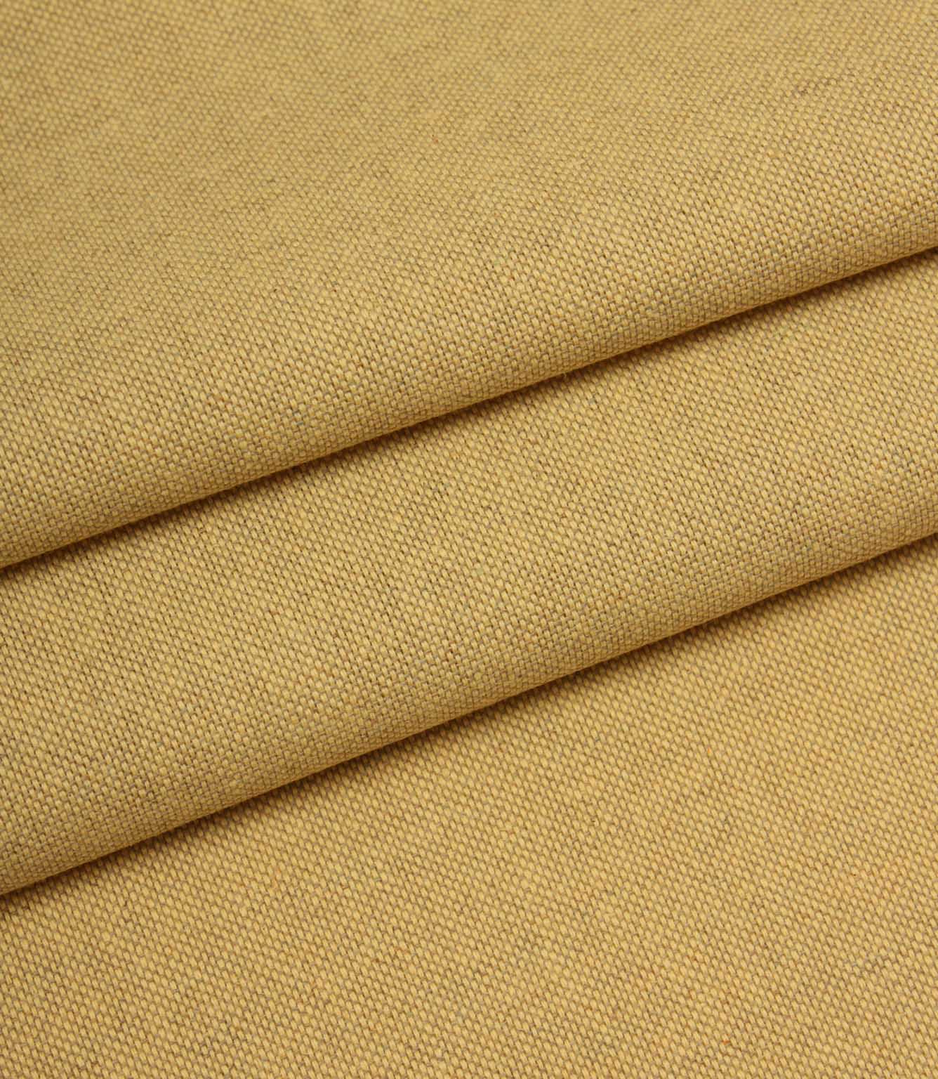 Close-up of yellow fabric with a textured pattern