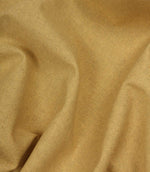 Close-up of yellow fabric with visible woven texture
