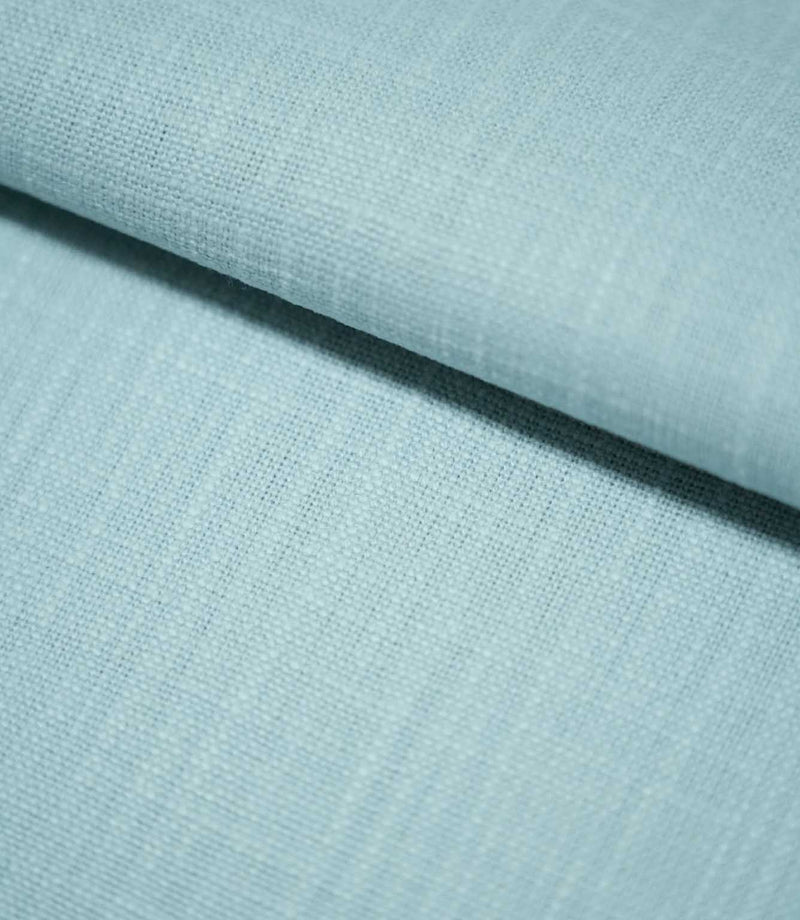 Waverley Duck Egg brushed cotton curtain and upholstery fabric arranged in a gentle fold, revealing its subtle woven texture and pale blue-green shade.