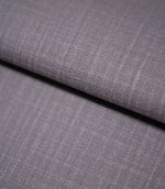 Waverley Heather 100% cotton curtain and upholstery fabric arranged in a soft fold, showing its fine woven structure and understated mauve-purple shade.