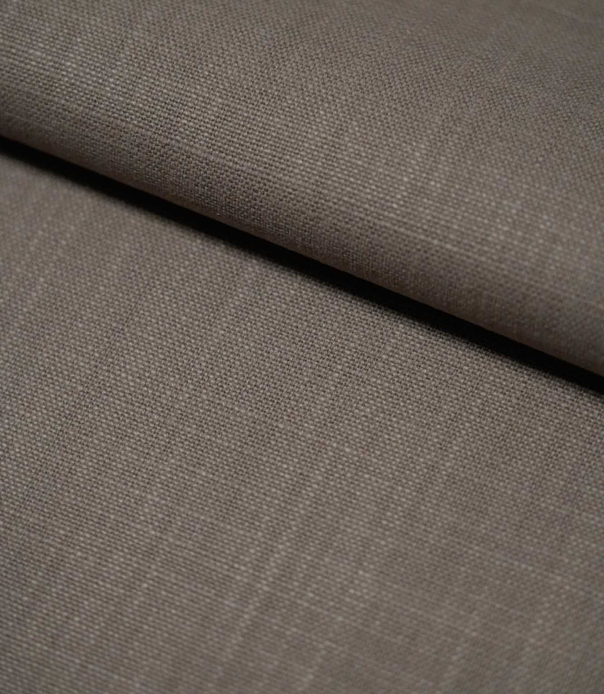 Waverley Mink plain 100% cotton fabric arranged in a single soft fold, showing its brushed surface, fine woven texture and understated taupe-grey appearance.
