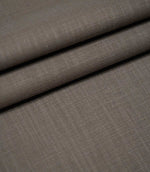 Waverley Mink brushed cotton upholstery and curtain fabric arranged in overlapping folds, showcasing its subtle woven texture, soft finish and muted brown-grey colouring.