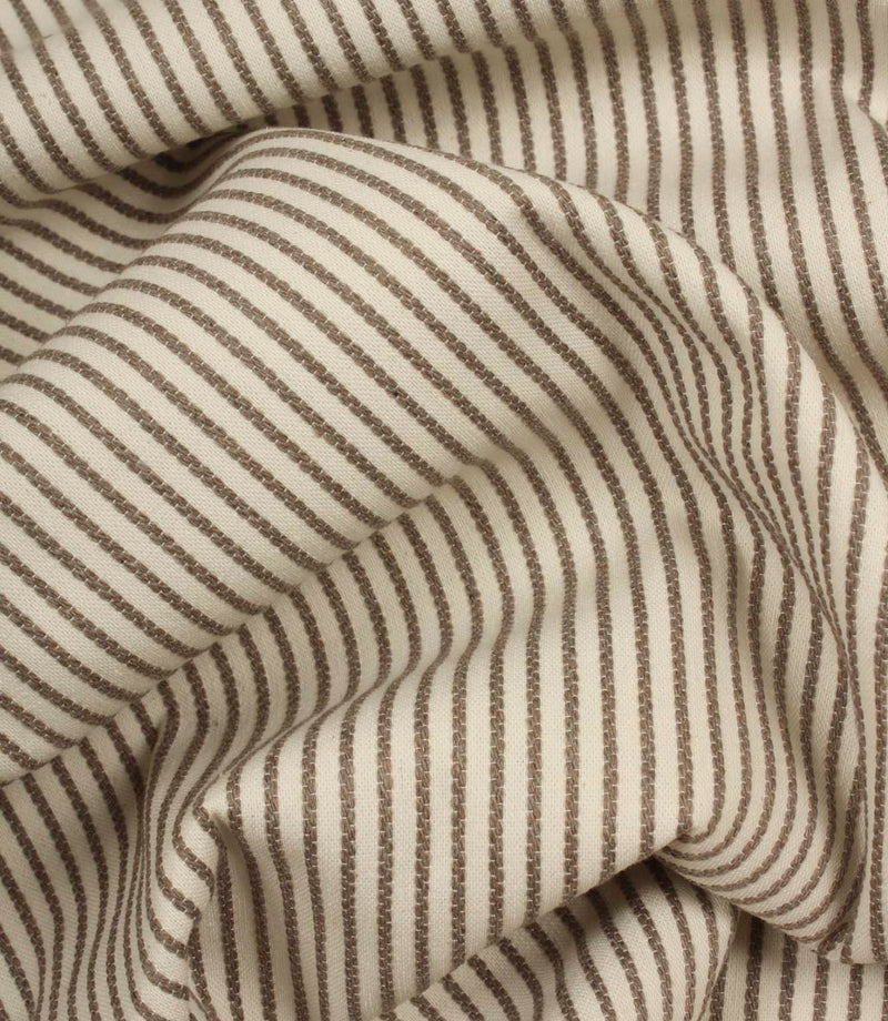 Draped Wedmore Wide ivory striped fabric with flowing folds, emphasising the textured woven surface and fine stripe pattern.