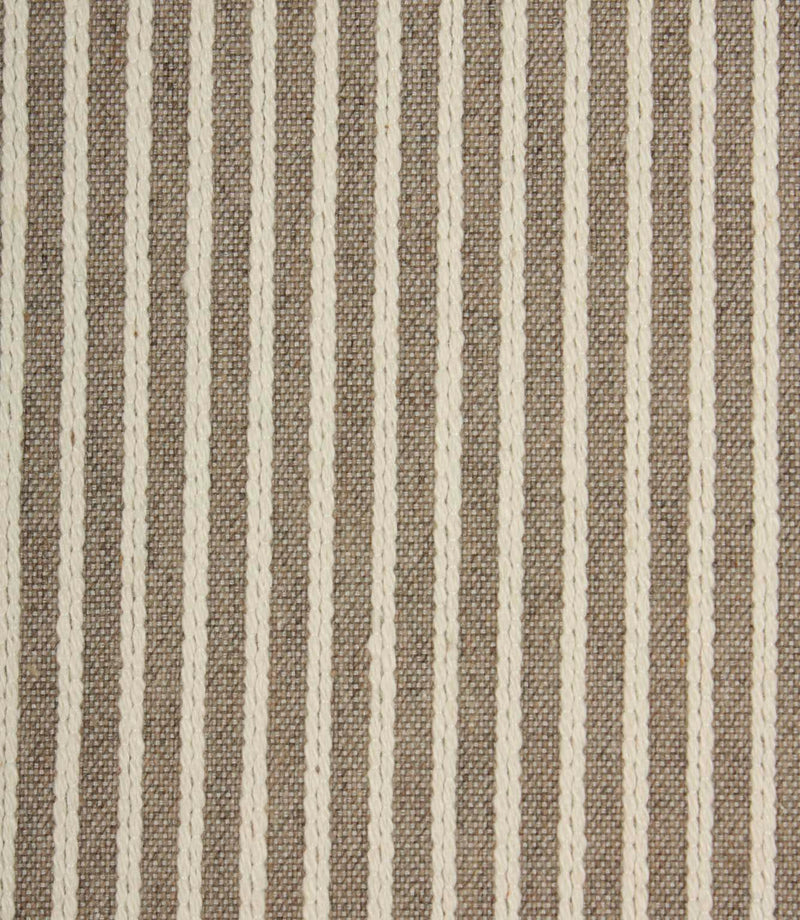 Close-up of Wedmore Wide extra wide upholstery fabric showing detailed woven stripes and textured embroidered finish.