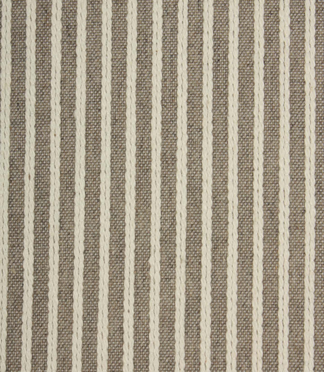 Close-up of Wedmore Wide extra wide upholstery fabric showing detailed woven stripes and textured embroidered finish.