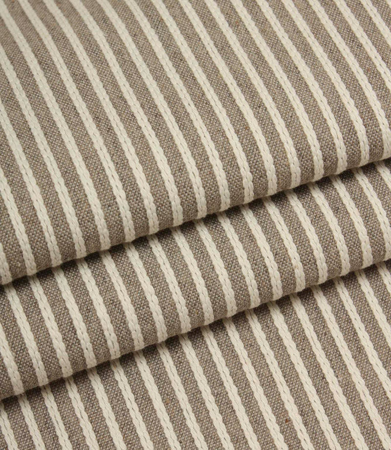 Folded Wedmore Wide woven stripe fabric showing the soft texture and drape of the upholstery material.