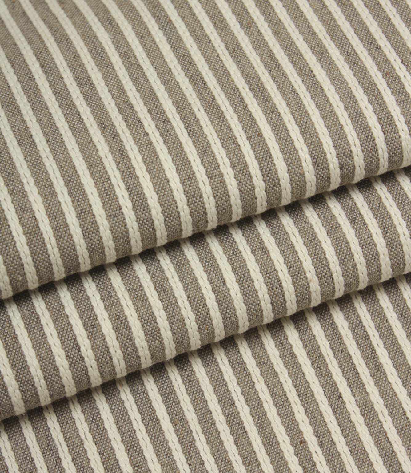 Folded Wedmore Wide woven stripe fabric showing the soft texture and drape of the upholstery material.
