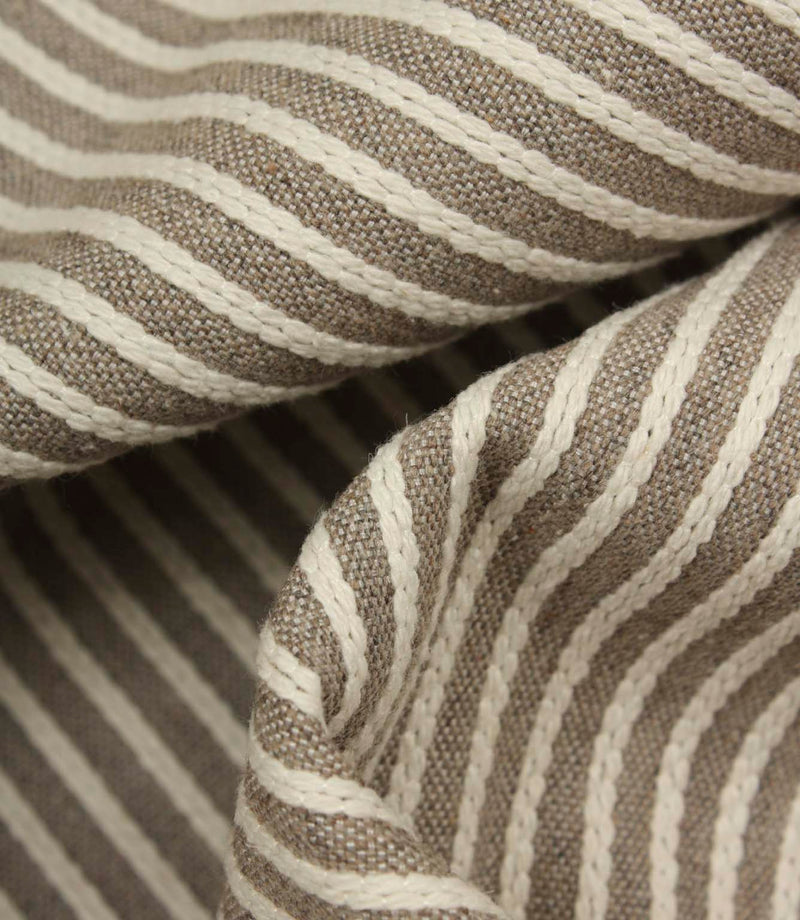 Detailed close-up of Wedmore Wide upholstery fabric folds showcasing the raised woven stripe design.