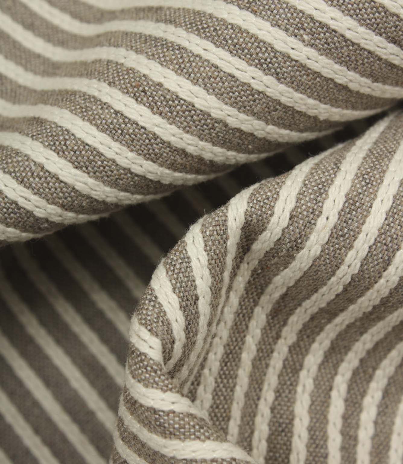 Detailed close-up of Wedmore Wide upholstery fabric folds showcasing the raised woven stripe design.