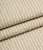 Folded Wedmore Wide woven fabric showcasing fine embroidered stripe detailing and a natural upholstery finish.