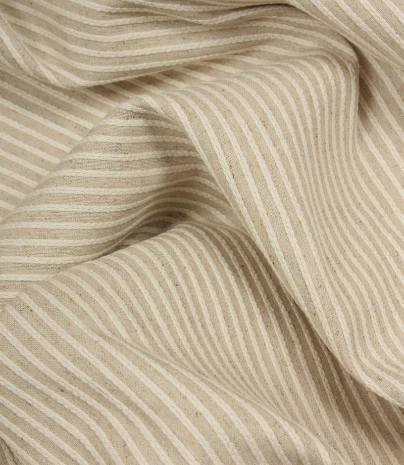 Draped Wedmore Wide striped fabric with soft flowing folds, showing its textured woven surface and narrow stripe pattern.