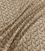 Wildwood Alder fabric draped in soft folds, showing the repeating small-scale botanical pattern of plum leaves, olive green stems and delicate branches on a natural cream ground.