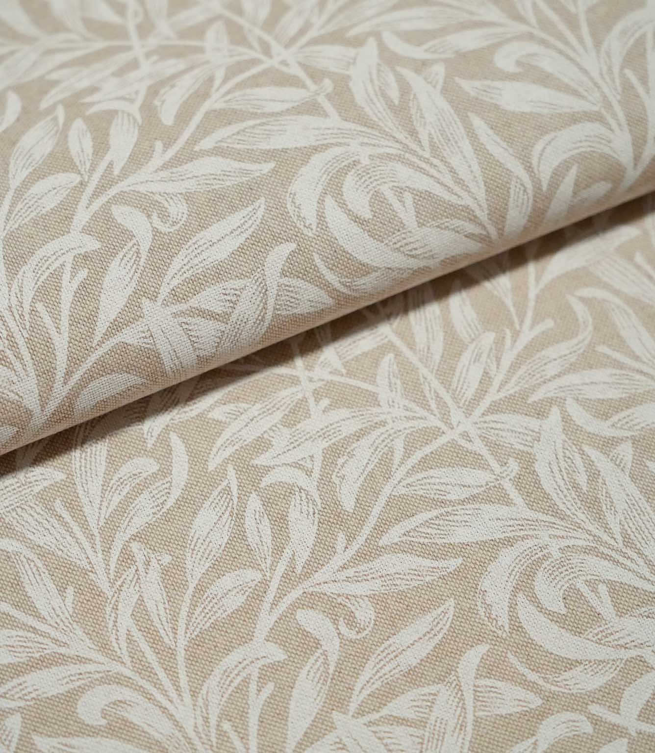 Folded Willow Bough Linen Look fabric in warm beige and cream, highlighting the repeating leafy pattern and textured linen-look weave.