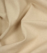 Close-up of beige fabric with a textured pattern