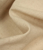 Close-up of woven beige fabric with visible texture